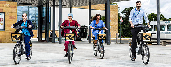 health workers on bicycles